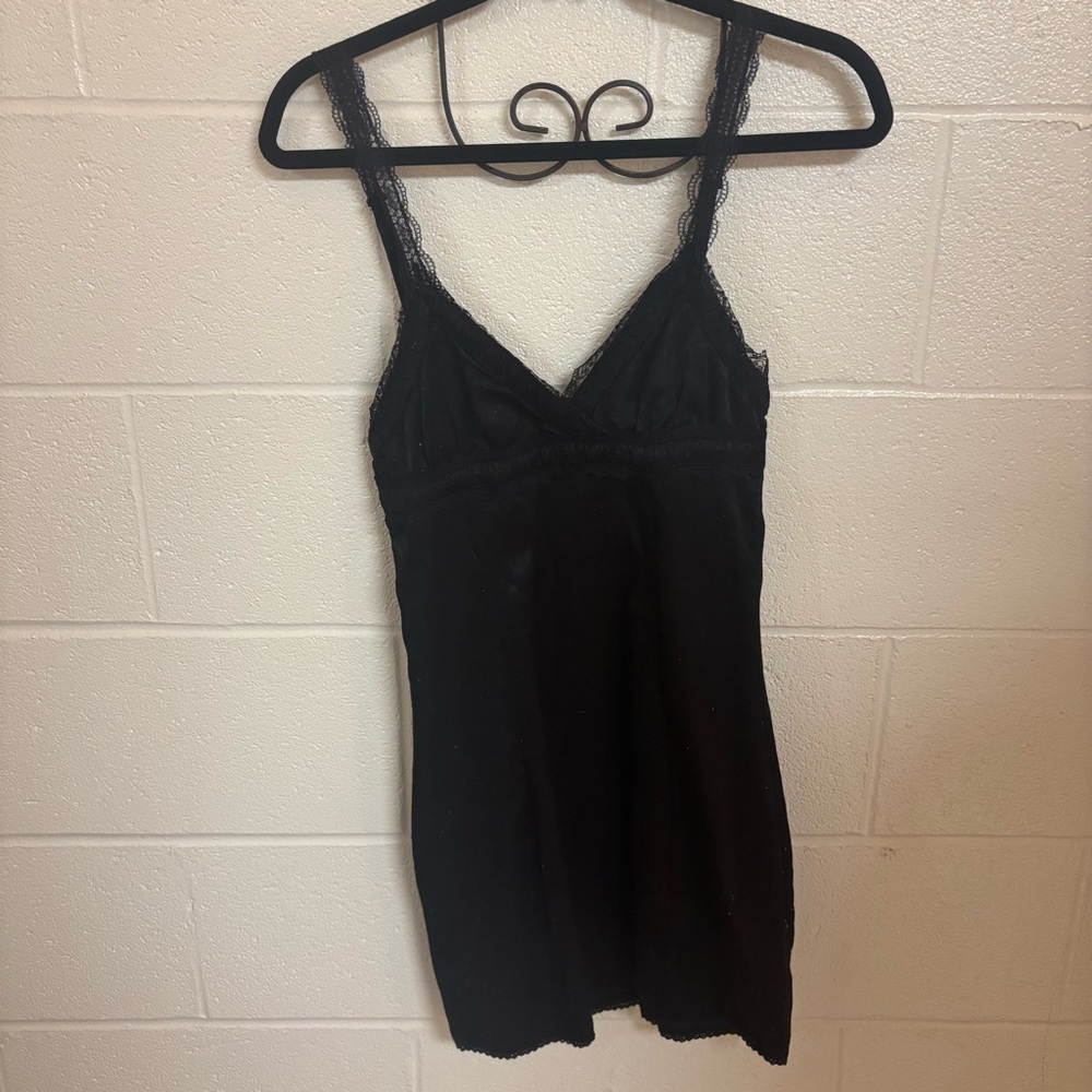 Black mini V-neck dress with lace trim and adjustable straps